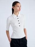 Detail image of model wearing Cooper Knit Polo in Micro Cable in OFF WHITE