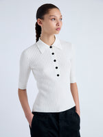 Detail image of model wearing Cooper Knit Polo in Micro Cable in OFF WHITE