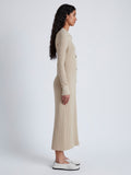 Side image of model wearing Phillips Knit Dress in Micro Cable in CASHEW