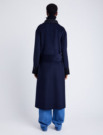 Proenza Schouler Back full length image of model wearing Constance Coat in Pinstripe Wool Cashmere in NAVY MELANGE