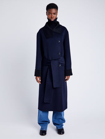 Proenza Schouler Front full length image of model wearing Constance Coat in Pinstripe Wool Cashmere in NAVY MELANGE with coat belt
