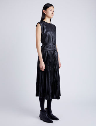 Proenza Schouler Side full length image of model wearing Lyra Pleated Top in Lightweight Faux Leather in BLACK
