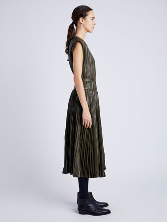Proenza Schouler Side full length image of model wearing Lyra Pleated Top in Lightweight Faux Leather in DARK FERN
