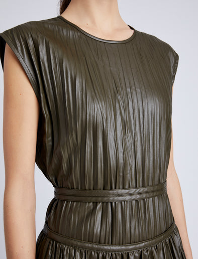 Proenza Schouler Detail image of model wearing Lyra Pleated Top in Lightweight Faux Leather in DARK FERN