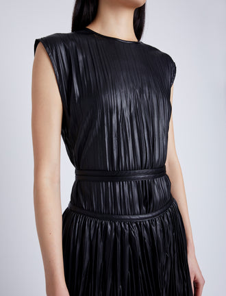 Proenza Schouler Detail image of model wearing Rosalyn Pleated Skirt in Lightweight Faux Leather in BLACK