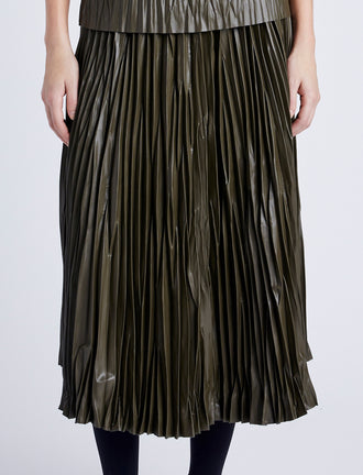 Proenza Schouler Detail image of model wearing Rosalyn Pleated Skirt in Lightweight Faux Leather in DARK FERN