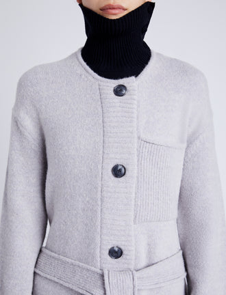 Proenza Schouler Detail image of model wearing Lenora Knit Cardigan in Wool Blend in LIGHT GREY