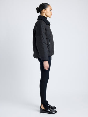 Proenza Schouler Side full length image of model wearing Veronica Coat in Parachute Cotton in BLACK