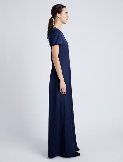 Proenza Schouler side image of model wearing Delphine Dress in Satin in INK