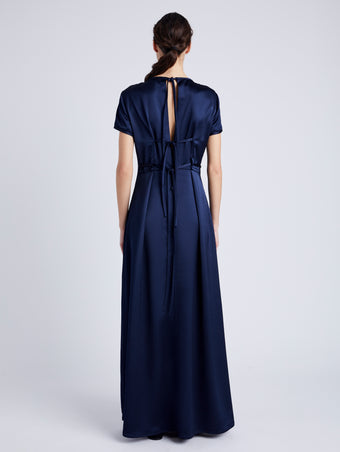 Proenza Schouler back image of model wearing Delphine Dress in Satin in INK