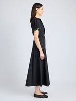 Proenza Schouler Side full length image of model wearing Elizabeth Dress in Parachute Cotton in BLACK