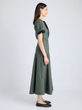 Proenza Schouler Side full length image of model wearing Elizabeth Dress in Parachute Cotton in DARK SPRUCE