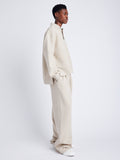 Proenza Schouler Side full length image of model wearing Genevieve Knit Pullover in Cloque in OATMEAL MELANGE