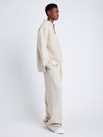 Proenza Schouler Side full length image of model wearing Genevieve Knit Pullover in Cloque in OATMEAL MELANGE