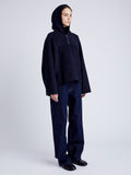 Proenza Schouler Side full length image of model wearing Isaac Hoodie in Double Face Wool in INK/BLACK