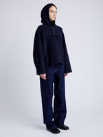 Proenza Schouler Side full length image of model wearing Isaac Hoodie in Double Face Wool in INK/BLACK
