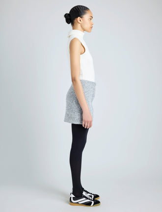 Proenza Schouler side image of model wearing Elise Skirt in Boucle in COAL/BLACK/ALABASTER