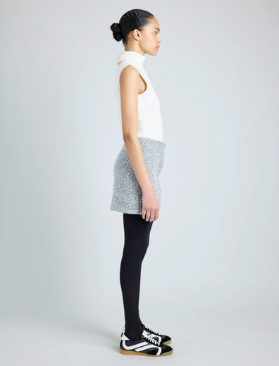 Proenza Schouler side image of model wearing Elise Skirt in Boucle in COAL/BLACK/ALABASTER
