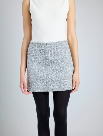 Proenza Schouler detail image of model wearing Elise Skirt in Boucle in COAL/BLACK/ALABASTER