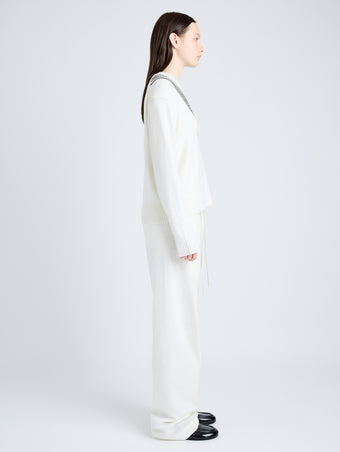 Proenza Schouler Side full length image of model wearing Gianna Top in Merino Stripe in OFF WHITE