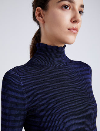 Proenza Schouler Detail image of model wearing Phyllis Turtleneck in Geo Knits in NAVY/BLACK