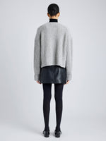 Proenza Schouler Back full length image of model wearing Azura Sweater in Moulinex Knits in PEBBLE MELANGE