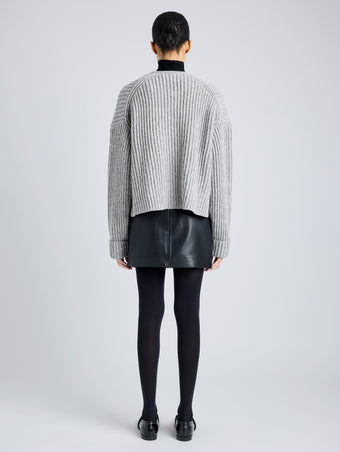 Proenza Schouler Back full length image of model wearing Azura Sweater in Moulinex Knits in PEBBLE MELANGE