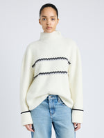 Proenza Schouler front cropped image of model wearing Anne Fairisle Sweater in Merino Wool in WHITE/BLACK/COAL