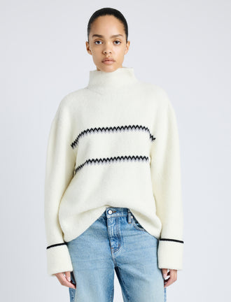 Proenza Schouler front cropped image of model wearing Anne Fairisle Sweater in Merino Wool in WHITE/BLACK/COAL