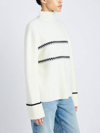 Proenza Schouler detail image of model wearing Anne Fairisle Sweater in Merino Wool in WHITE/BLACK/COAL