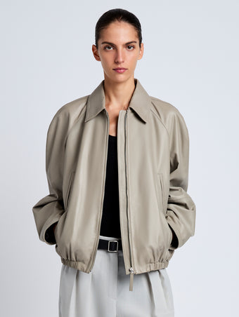 Proenza Schouler Front cropped image of model wearing Beck Bomber in Lightweight Nappa in Granite
