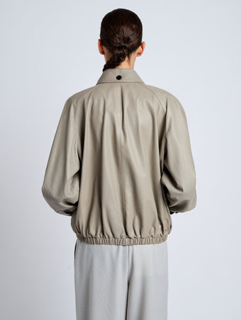 Proenza Schouler Detail image of model wearing Beck Bomber in Lightweight Nappa in Granite