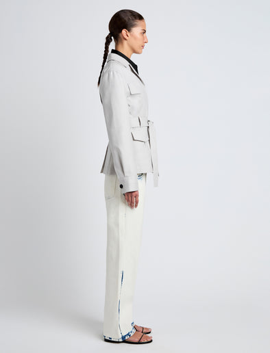 Proenza Schouler Side full length image of model wearing Indie Jacket in Stretch Cotton Suiting in Pale Grey