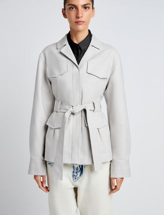 Proenza Schouler Detail image of model wearing Indie Jacket in Stretch Cotton Suiting in Pale Grey