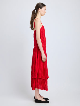 Proenza Schouler Side full length image of model wearing Clyne Dress in Pleated Jersey in Dark Poppy