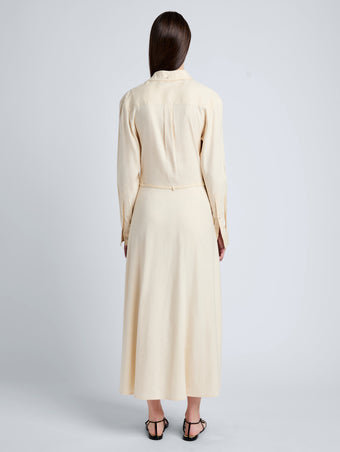Proenza Schouler Back full length image of model wearing Lato Wrap Dress in Linen Slub in Light Wheat