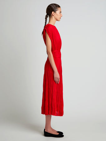 Proenza Schouler Side full length image of model wearing Lyra Top in Pleated Jersey in Dark Poppy