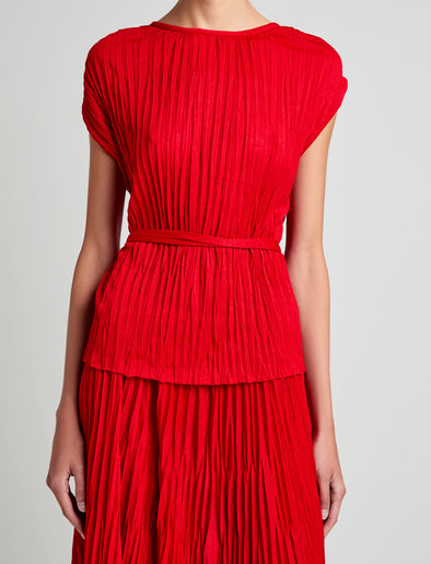 Proenza Schouler Detail image of model wearing Lyra Top in Pleated Jersey in Dark Poppy