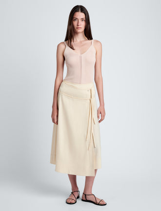 Proenza Schouler Front full length image of model wearing Jovie Wrap Skirt in Linen Slub in Light Wheat