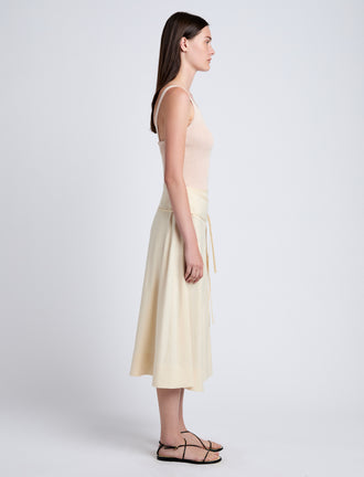 Proenza Schouler Side full length image of model wearing Jovie Wrap Skirt in Linen Slub in Light Wheat