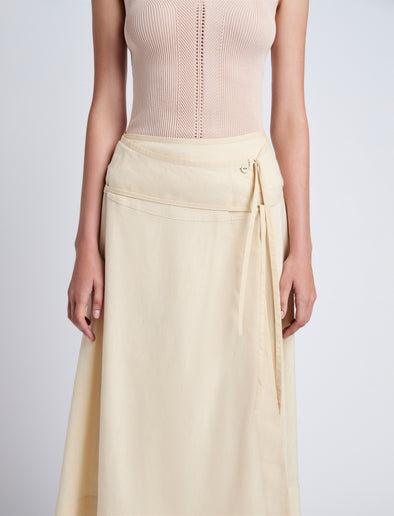 Proenza Schouler Detail image of model wearing Jovie Wrap Skirt in Linen Slub in Light Wheat