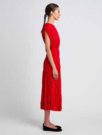 Proenza Schouler Side full length image of model wearing Rosalyn Skirt in Pleated Jersey in Dark Poppy