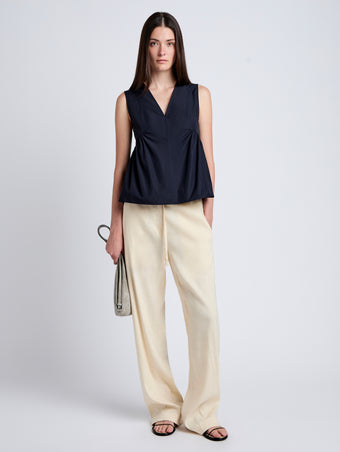 Proenza Schouler Front full length image of model wearing Magnus Pant in Linen Slub in Light Wheat