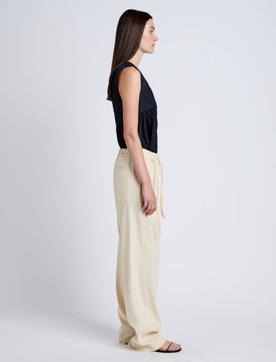 Proenza Schouler Side full length image of model wearing Magnus Pant in Linen Slub in Light Wheat