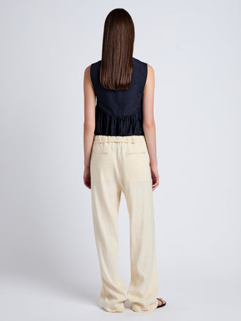 Proenza Schouler Back full length image of model wearing Magnus Pant in Linen Slub in Light Wheat