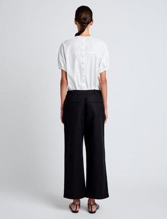 Proenza Schouler Back full length image of model wearing Cali Pant in Stretch Cotton Suiting in Black