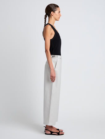 Proenza Schouler Side full length image of model wearing Cali Pant in Stretch Cotton Suiting in Pale Grey