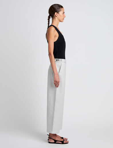 Proenza Schouler Side full length image of model wearing Cali Pant in Stretch Cotton Suiting in Pale Grey
