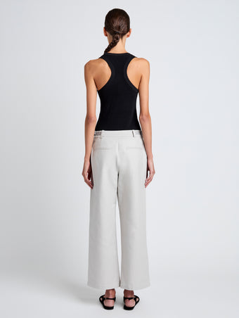 Proenza Schouler Back full length image of model wearing Cali Pant in Stretch Cotton Suiting in Pale Grey