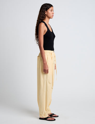 Proenza Schouler Side full length image of model wearing Aston Pant in Tech Cotton in Light Wheat